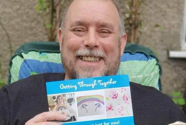 One of the service users receives his wellbeing pack.