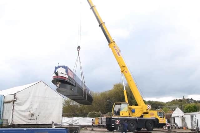 Calopteryx is hoisted into the canal at Wheelton