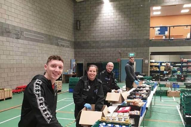 Lancaster Police helping out at the foodbank.