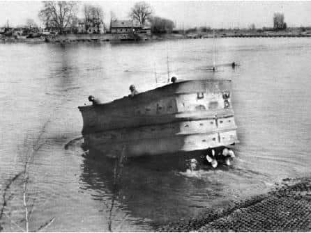 Corporal Wilson went to war in a Sherman DD swimming tank-these were waterproofed tanks fitted with a canvas screen to provide buoyancy and propellers at the rear to drive the tank in the water. Here a DD tank is entering the water.