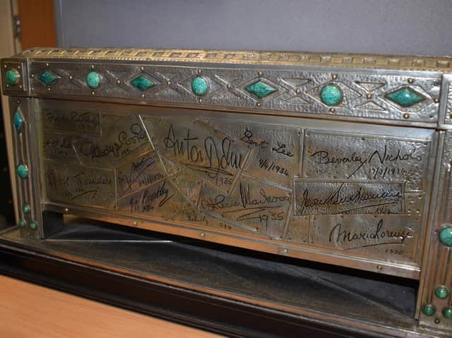 Up for auction at 1818 Auctioneers, a jewelled casket covered in a time capsule of famous people from the 1930s.