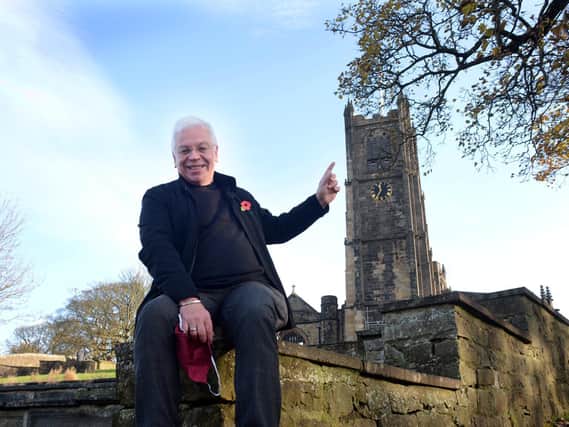 Vicar of Lancaster, the Rev. Canon Chris Newlands, celebrates the funding to restore Lancaster Priory's historic clock tower.