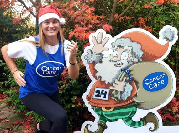 CancerCare’s Holly Salisbury with the official Santa Dash mascot,