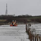 The fire service deployed two swift water rescue technicians who entered the water using a sled and brought the elderly man to safety. Firefighters also helped recover his stranded car from the flood water. Pic: Morecambe Lifeboat