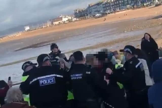 The chaotic scenes on Morecambe Promenade this afternoon (Saturday, November 21) after a woman was arrested at an anti-lockdown protest