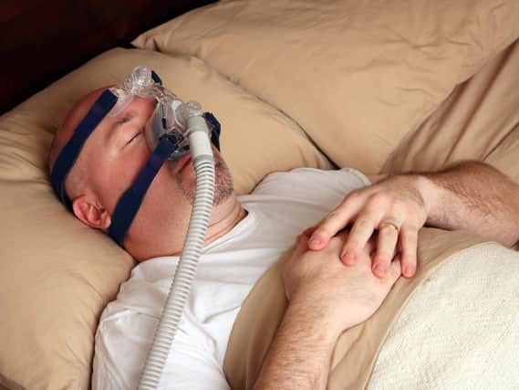 A CPAP airway machine in use.