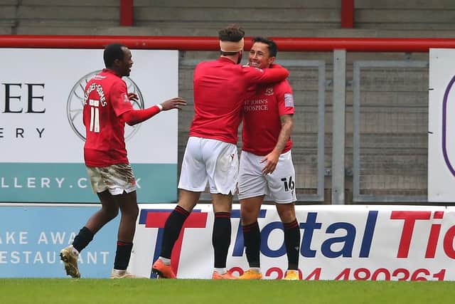 Carlos Mendes-Gomes and Cole Stockton congratulate John O'Sullivan on his goal against Solihull Moors   Picture: Getty Images