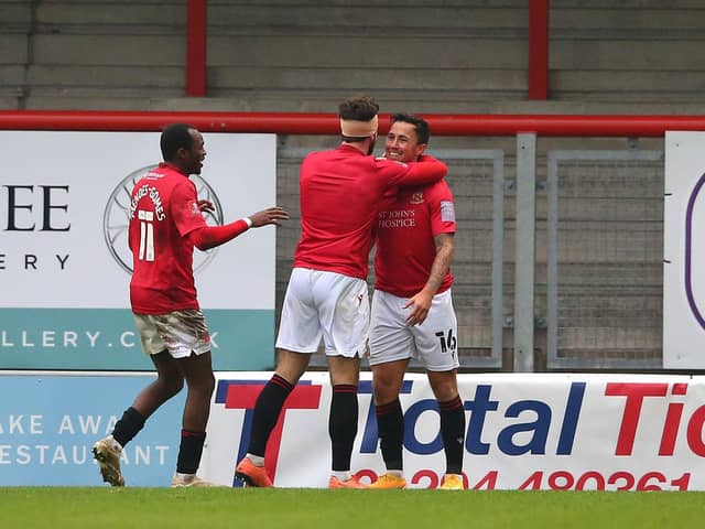 Carlos Mendes-Gomes and Cole Stockton congratulate John O'Sullivan on his goal against Solihull Moors   Picture: Getty Images