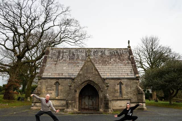 Andrew Vickers and Maya Florkowski perform some Tai Chi moves at Lancaster Cemetery. Photo: Kelvin Stuttard