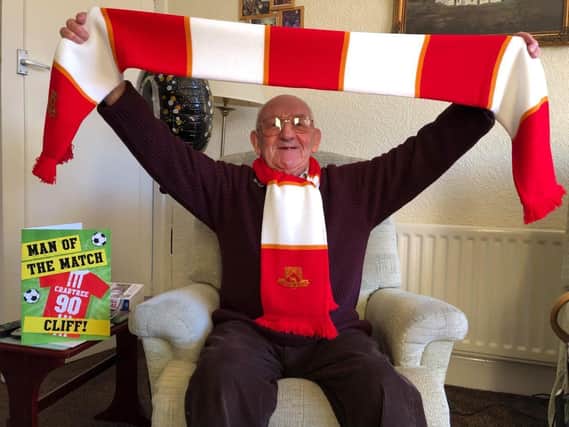 Cliff Crabtree celebrated his 90th birthday with a visit from the Morecambe FC team, who presented him with a signed card, scarf and mug.
