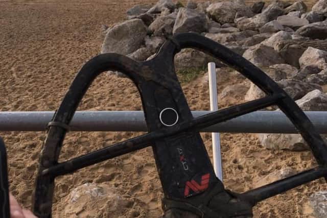 Rachael's wedding ring on the metal detector used to find it.