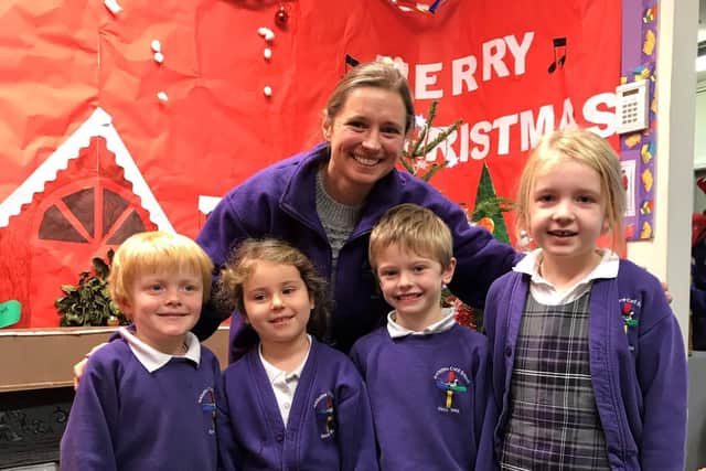 Emma Muckalt with children from Arkholme Church of England Primary School.