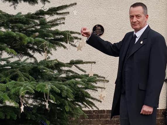 Andrew Taylor from Lancaster & Morecambe Crematorium with the memorial Christmas tree.