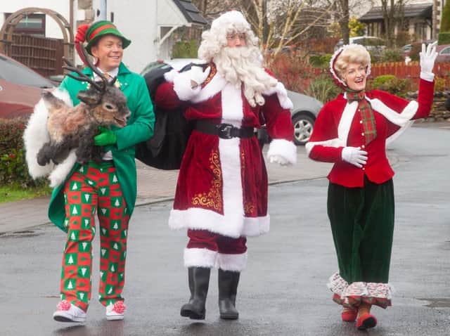 Father and Mrs Christmas, along with elf Jangle and baby reindeer Jingle, make their weekend visit to Louise Phillips and her family in Kendal.