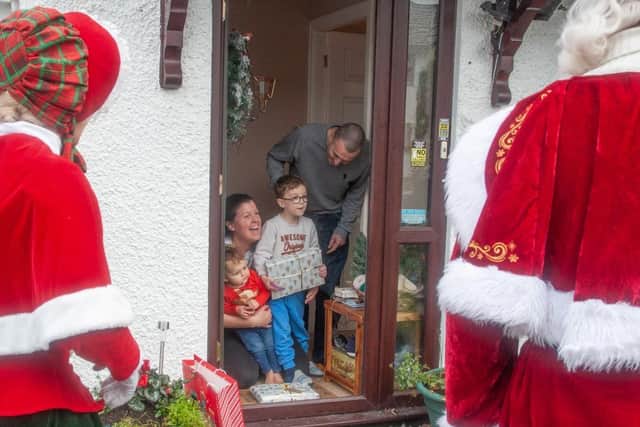 Father and Mrs Christmas, along with elf Jangle and baby reindeer Jingle, make their weekend visit to Louise Phillips and her family in Kendal.