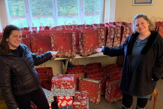 Zsuzsanna Brenner-Daly, St Joseph’s RC Church’s outreach co-ordinator, right, with Laura Gatti and some of the Christmas shoe boxes.