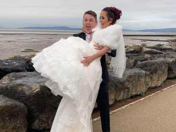 Emily McKechnie and new husband Harry Martin celebrate on Morecambe prom after finally being able to get married this week.