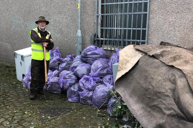 Paul Hart with some of the rubbish and flytipped goods on Back Kensington Road in Morecambe which was cleared by volunteers.