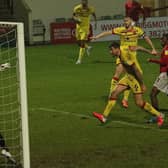 Carlos Mendes-Gomes heads home Morecambe's equaliser against Walsall in midweek