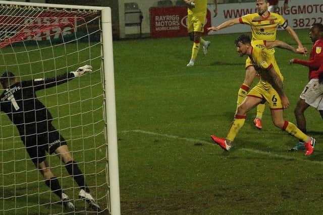 Carlos Mendes-Gomes heads home Morecambe's equaliser against Walsall in midweek