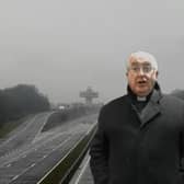 This still image from a video by David France shows the Rev Canon Peter Ballard giving his sermon "from the M6 at Forton".