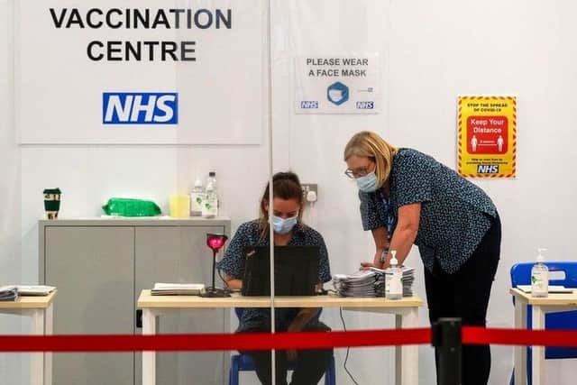 Mass vaccination centres are delivering jabs, alongside GP and hospital hubs and community pharmacies (image: Peter Byrne/PA Wire)