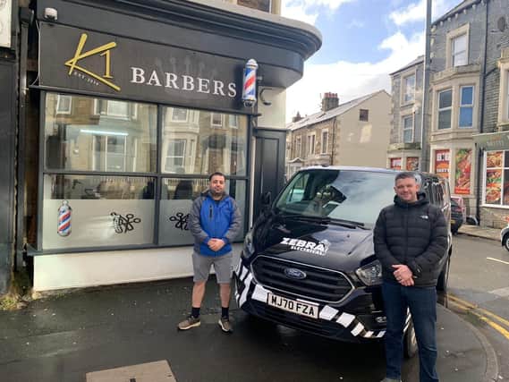 Kywan Mohammadi of K1 Barbers got some free help from electrician Jacob Hughes from Zebra Electrical.