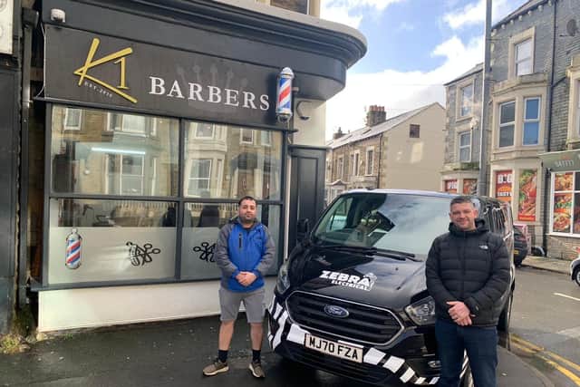 Kywan Mohammadi of K1 Barbers got some free help from electrician Jacob Hughes from Zebra Electrical.