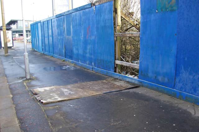 One of the fence panels had fallen onto the pavement last week.