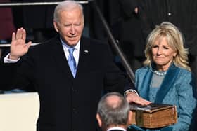 Joe Biden (L), flanked by incoming US First Lady Jill Biden is sworn in as the 46th US President by Supreme Court Chief Justice John Roberts on January 20, 2021, at the US Capitol in Washington, DC. Note the  Haydock bible on which Joe Biden swears his presidential oath (Photo by SAUL LOEB / POOL / AFP) (Photo by SAUL LOEB/POOL/AFP via Getty Images)