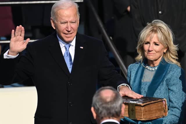 Joe Biden (L), flanked by incoming US First Lady Jill Biden is sworn in as the 46th US President by Supreme Court Chief Justice John Roberts on January 20, 2021, at the US Capitol in Washington, DC. Note the  Haydock bible on which Joe Biden swears his presidential oath (Photo by SAUL LOEB / POOL / AFP) (Photo by SAUL LOEB/POOL/AFP via Getty Images)