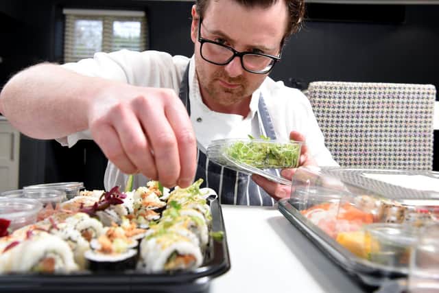 Adam Hitchen  perfects the appearance of his  tray of sushi    Photo: Neil Cross