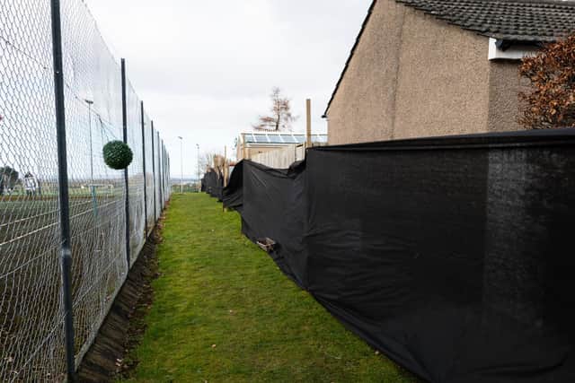Residents have erected the black screen to show how close the development would be to their homes in Clougha Avenue.