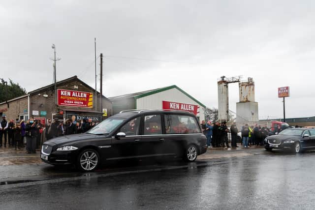 Ken Allen's funeral cortege passes by his business on White Lund. Photo by Kelvin Stuttard