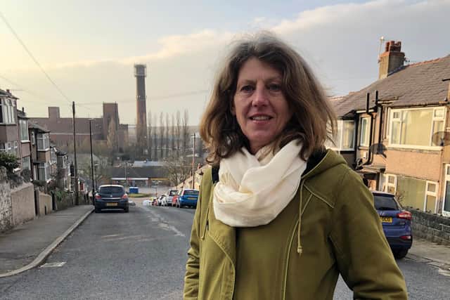 Coun Gina Dowding at the top of Wharfedale Road with the chimney in the background.