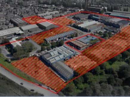 An aerial view of the site and existing buildings. Undeveloped land is highlighted.