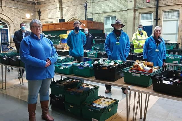 Heysham Power Station representatives and FMorecambe Bay Foodbank volunteers in The Platform. Staff at the power stations donated the cost of their usual Christmas lunches to the Foodbank