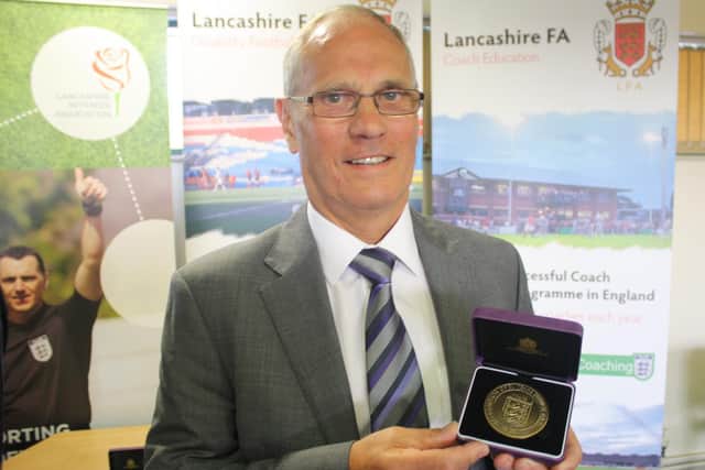 Morecambe FC's Dickie Danson receives his award from the Football Association.
