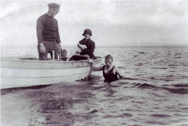 Maureen Newsham swimming from Grange to Morecambe circa 1920-1. Her cousin Lil Barrow is in the boat timekeeping.