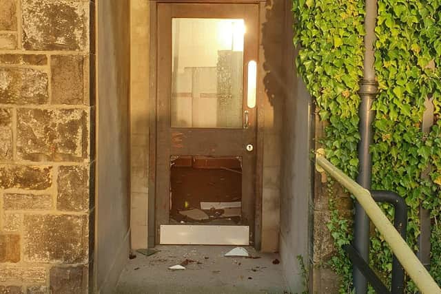 Damage caused to a door on the UCUM campus.