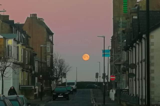The wolf moon setting over the bay at 8am on Monday. Photo by Anthony Sutton