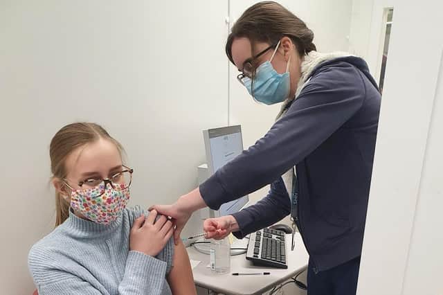 Chloe Barnes receives her vaccine.