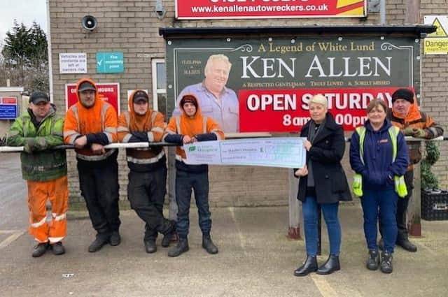 The team at Ken Allen Autowreckers Ltd donating £582.31 to St John's Hospice in Ken's memory as it was one of his favourite charities.