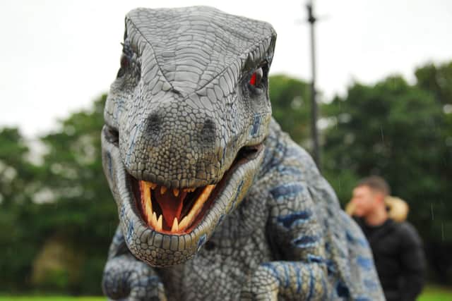 Dinosaurs meet locals in the grounds of Morecambe Town Hall. Photo by Michelle Adamson.