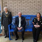 Steve Trainor and Lisa-Marie Walkden (seated) presented the bench to the Royal Lancaster Infirmary. They are pictured with (from left) Mayoress of Lancaster Margaret Greenall, Mayor of Lancaster Mike Greenall, and UHMBT Non-Executive Director Adrian Leather.