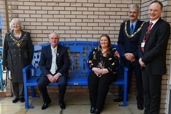 Steve Trainor and Lisa-Marie Walkden (seated) presented the bench to the Royal Lancaster Infirmary. They are pictured with (from left) Mayoress of Lancaster Margaret Greenall, Mayor of Lancaster Mike Greenall, and UHMBT Non-Executive Director Adrian Leather.