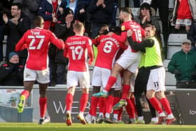 Morecambe's players celebrate Aaron Wildig's goal at the weekend