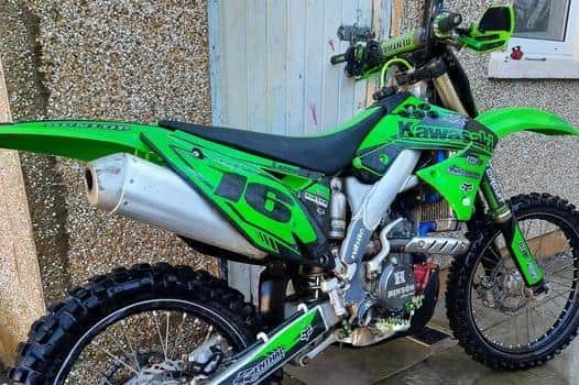 Two thugs riding an e-scooter threatened a man with a knife before stealing his Kawasaki KX250F motorbike in Lancaster. (Credit: Lancashire Police)