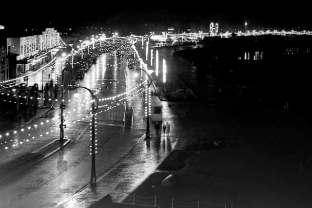 A Visitor newspaper glass plate negative shows the view along Morecambe Illuminations after the switch-on in 1954.