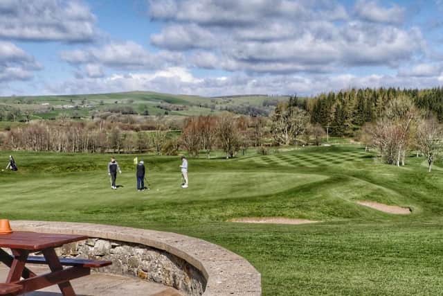 Golfers enjoying the sunshine on the 9th hole at Kirkby Lonsdale Golf Club.